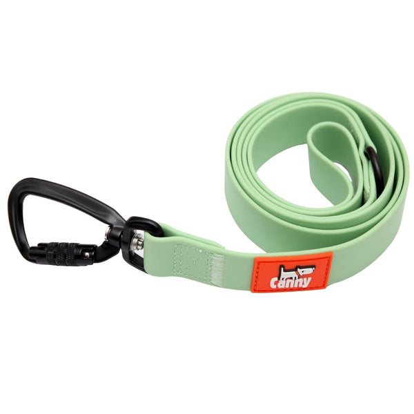 Mint green waterproof and odorless leash rolled up, featuring orange brand patch and black swivel carabiner.